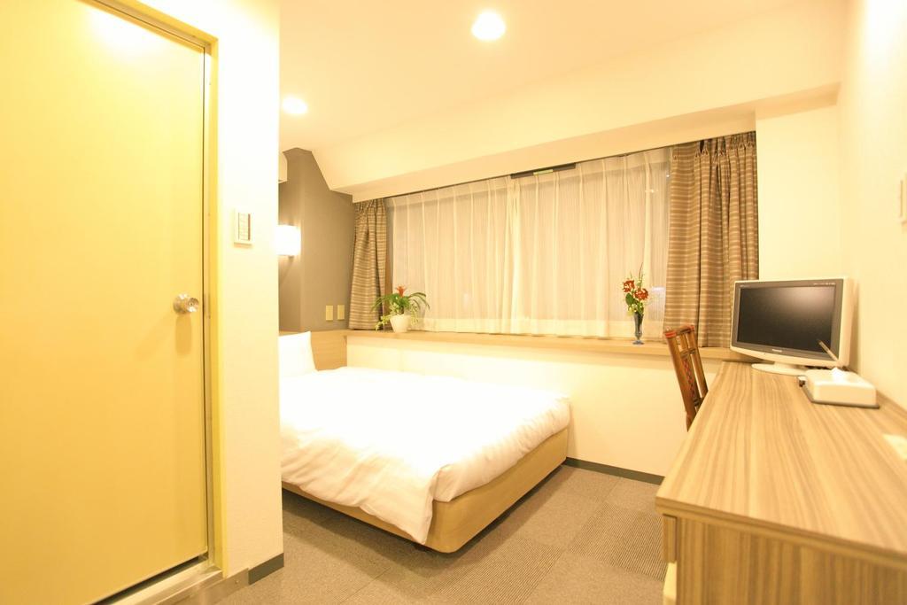 Hotel Marutani Tokio Habitación foto